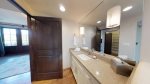 Secondary en-suite bathroom with granite countertops